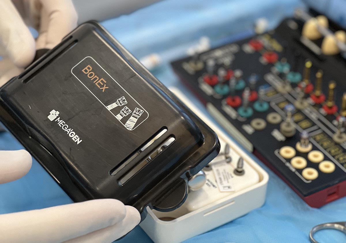 Dentist is checking up a patient with an ortodental system